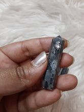 One larvikite pencil Point less than 2 inches
