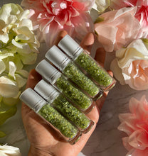 One green prehnite Chips Bottle Black Obsidian Roller