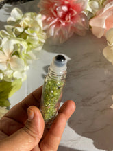One green prehnite Chips Bottle Black Obsidian Roller